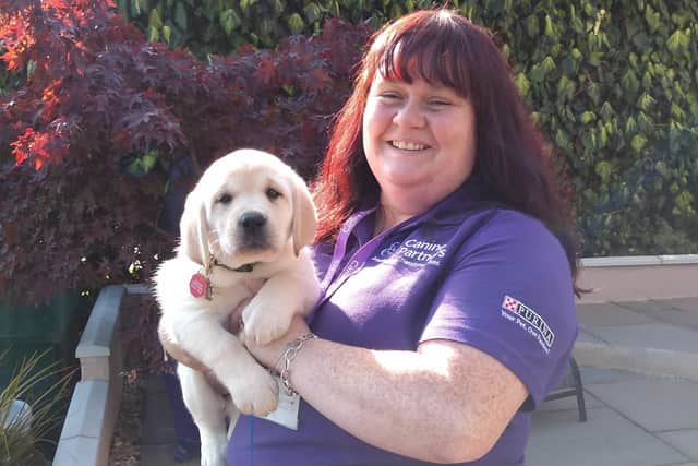 Canine Parteners trainer Jill Stewart with soon-to-be assistance dog Red