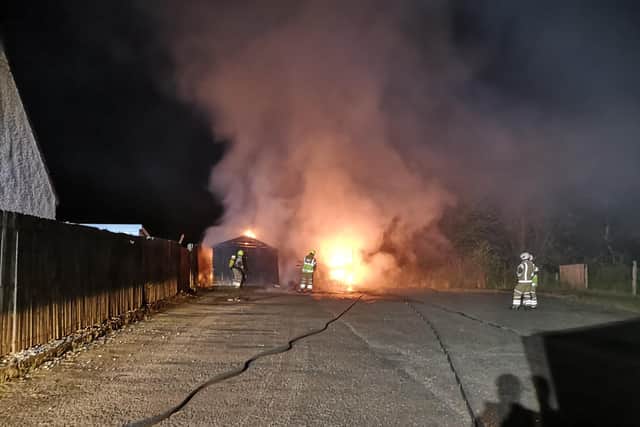 Two garages went up in flames in Oronsay Avenue, Maddiston last night. Pictures and video: Steven Derry.