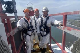 Learners Calvin Stewart, Michael Johnstone and Niall Gibb on top of a wind turbine during the WTT pilot