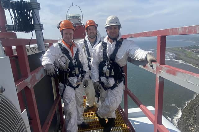 Learners Calvin Stewart, Michael Johnstone and Niall Gibb on top of a wind turbine during the WTT pilot