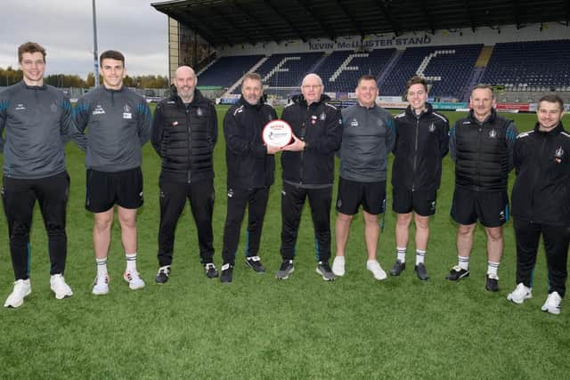 Falkirk gaffer John McGlynn and back-room staff at the William Hill Championship table-toppers with his award for manager of the month for October (Photo: Ian Sneddon)