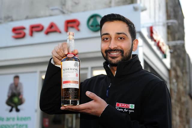 Anand Cheema, owner of SPAR in Maggie Wood's Loan, Falkirk, was named Impulse Retailer of the Year Award at the Asian Trader Awards thanks, in part, to the rare whiskies the store offers. Picture: Michael Gillen.
