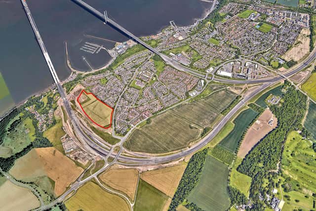 An aerial shot showing the site, marked in red.