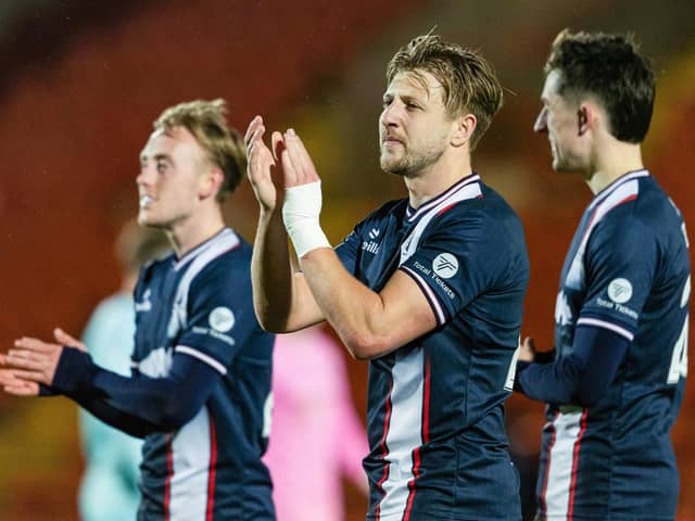 Falkirk ace Sean Mackie applauds the travelling fans after the 3-0 win at Airdrieonians on Tuesday evening (Photo: Craig Foy/SNS Group)