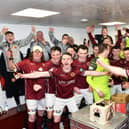 Changing room joy after being crowned League Two champions.