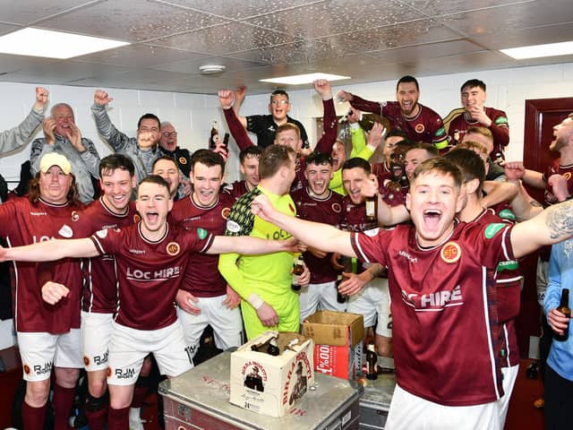 Changing room joy after being crowned League Two champions.