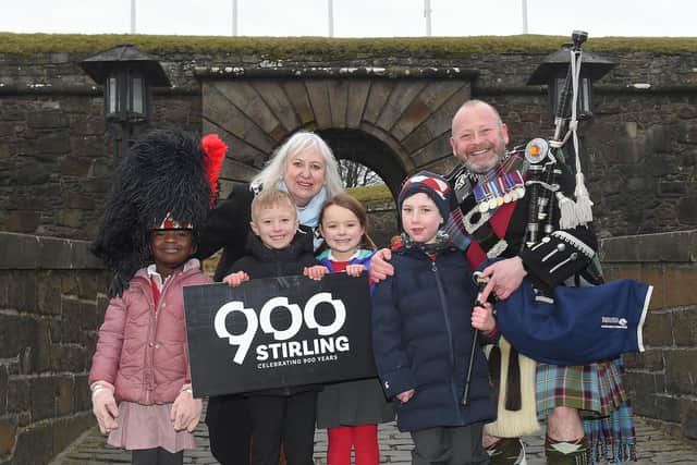 Lord Provost Elaine Watterson and Pipe Major Scott Methven at Stirling Castle with children from Allan’s Primary School.  Pic: Whyler Photos/Stirling Council