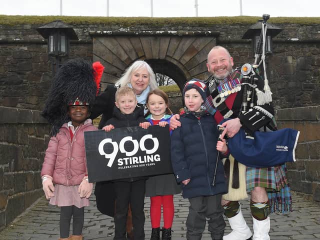 Lord Provost Elaine Watterson and Pipe Major Scott Methven at Stirling Castle with children from Allan’s Primary School.  Pic: Whyler Photos/Stirling Council