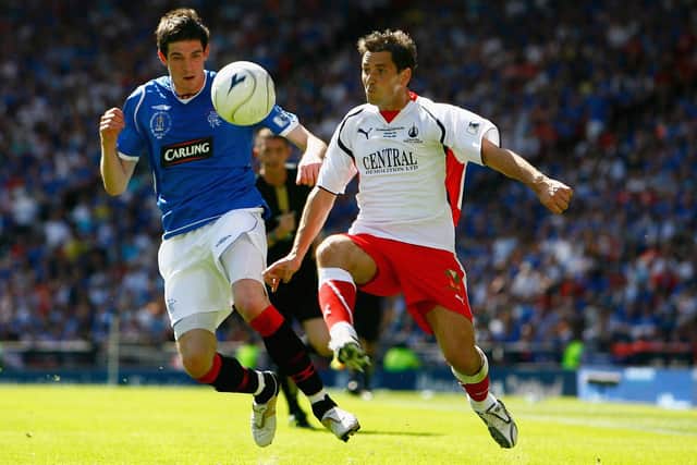 Kyle Lafferty of Rangers challenges Falkirk's Jackie McNamara during 2009's Scottish Cup final at Glasgow's Hampden Park (Photo by Jeff J Mitchell/Getty Images)