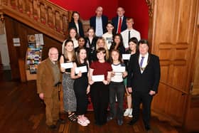 Dennis Canavan scholarship award presentation with judges and nominees. Front row: Dennis Canavan; Chloe Munnoch, Braes High School; Gemma Dick, Falkirk High School; Gracie Proudlock, Braes High School; Diana Kaliukeviciute, Falkirk High School; Katie Misell, Braes High School and Provost Robert Bissett. Pic: Michael Gillen