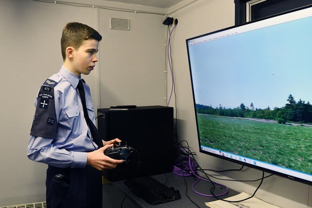 One air cadet is paying very close attention to his task.