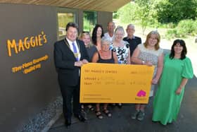 Provost Robert Bissett handed over a cheque for £4000 on behalf of Westquarter and Redding Unity Club to Yvonne McIntosh, entre Head. Pic: Michael Gillen