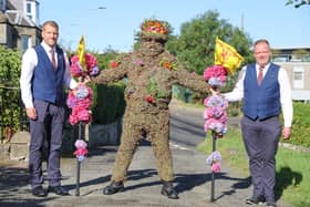 Burryman and attendants, Duncan Thompson (left) and Andrew Findlater, prepare to leave the Provost’s House.