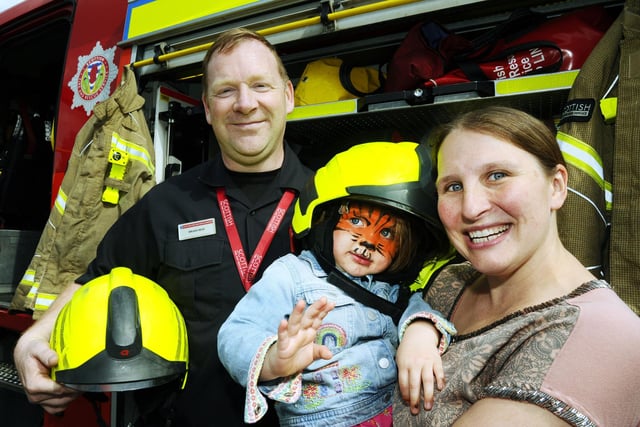 Sophie Bradford (2) and her Mum met firefighter Brian Reid.