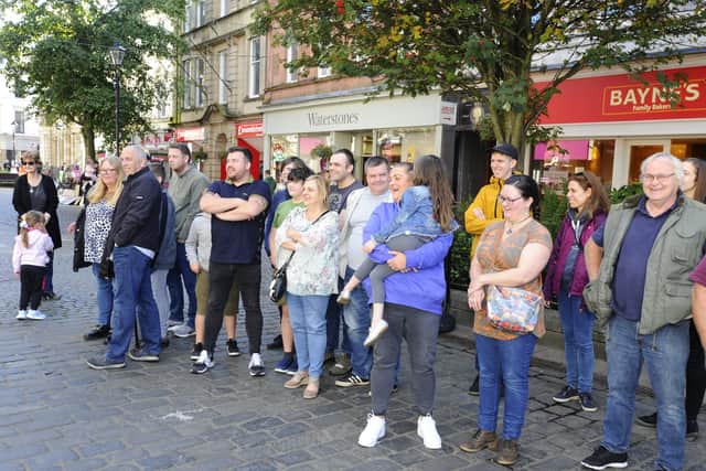 A crowd gathered to watch the proclamation and sing Happy Birthday to the sisters.  Pic: Alan Murray.