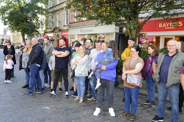 A crowd gathered to watch the proclamation and sing Happy Birthday to the sisters.  Pic: Alan Murray.