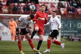 Coll Donaldson looks to win the ball up against Clyde's Martin Rennie (Pictures by Alan Murray)