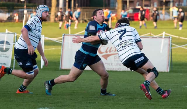 Falkirk's Gregor Ramsay tries to evade a tackle