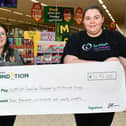 Morrisons Falkirk community champion Charlotte Counsell presents a cheque to Clare Morrison of Scottish Families Affected by Alcohol and Drugs.