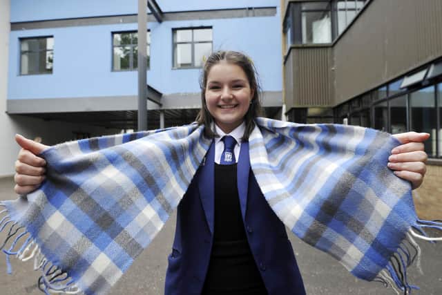 Larbert High S5 pupils Heather Cowie displays the school's newly registered tartan. Picture: Michael Gillen.