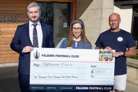 Falkirk’s commercial manager Sean Skelly presents the hospice cheque (Photo: Falkirk FC)