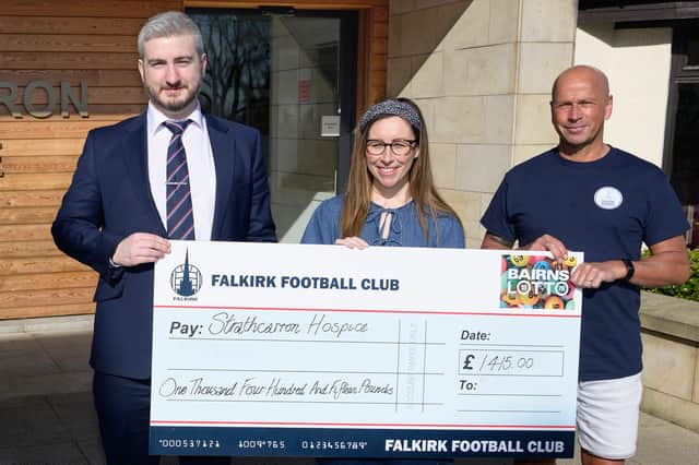 Falkirk’s commercial manager Sean Skelly presents the hospice cheque (Photo: Falkirk FC)