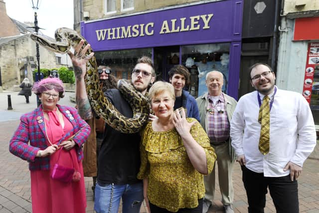 Doris Lenaghen from Whimsic Alley with Larry the Burmese python and Will Reid.