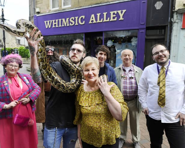 Doris Lenaghen from Whimsic Alley with Larry the Burmese python and Will Reid.