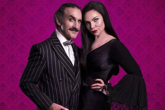 Cameron Blakely and Samantha Womack as Morticia and Gomez Addams