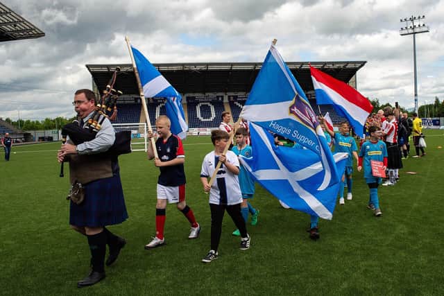 This year's Lava Cup piper and ball boys are pictured before kick-off at Falkirk Stadium back in May (Pics by Garry F McHarg)