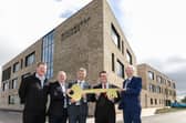 David Wright from Morrison Construction, John Hamilton from Winchburgh Developments Ltd and Scott Brown from Hub South East officially hand over the building to West Lothian Council’s Executive councillor for Education, Andrew McGuire and Leader of West Lothian Council, Lawrence Fitzpatrick.