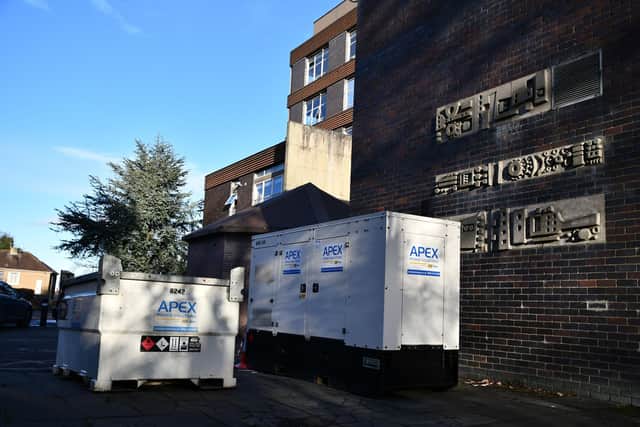 External power generators can be seen at the rear of the town hall building - but the temporary boilers failed this week