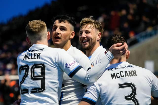 MONTROSE, SCOTLAND - MARCH 30: Falkirk's Ryan Shanley celebrates with Calvin Miller, Sean Mackie and Leon McCann after scoring to make it 7-1 during a cinch League One match between Montrose and Falkirk at Links Park Stadium, on March 30, 2024, in Montrose, Scotland.  (Photo by Sammy Turner / SNS Group)