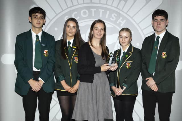 Teacher Heather Anderson and pupils from St Mungo's High School receive award from the Scottish Fire & Rescue Service. Pic: Contributed