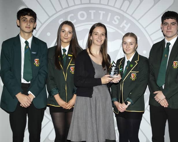 Teacher Heather Anderson and pupils from St Mungo's High School receive award from the Scottish Fire & Rescue Service. Pic: Contributed