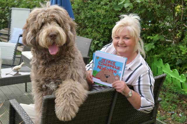 Larbert resident Esther-Anne Love has written a series of children's books based on her dog, George. Picture: Michael Gillen.