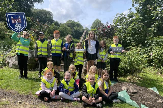All Blackness Primary's 15 pupils bury a time capsule to mark school's closure. Pic: Contributed