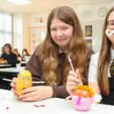 Graeme High School S1 English pupils Grace Hamilton, 12, and Ellie Counsell, 12, get busy decorating their spuds(Picture Scott Louden, National World)
