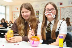 Graeme High School S1 English pupils Grace Hamilton, 12, and Ellie Counsell, 12, get busy decorating their spuds(Picture Scott Louden, National World)