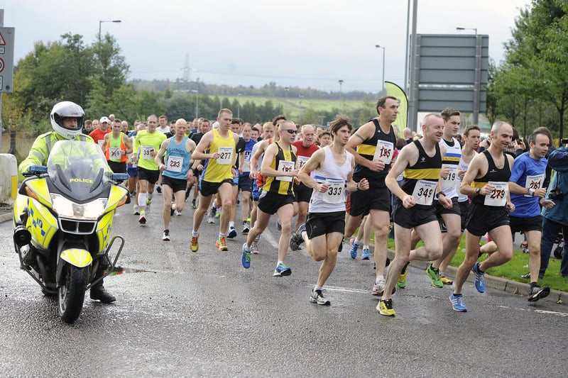 Runners supported by police outriders