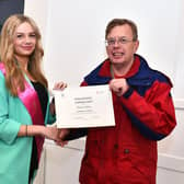 Romany Shaw, Miss Teen Stirlingshire presents Richard Hadlow with his Local Hero Award. Pic: Michael Gillen