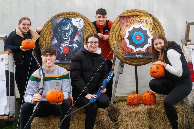 Visitors Daire, Adam, Aoife, Chloe and Charlotte try out the pumpkin archery.