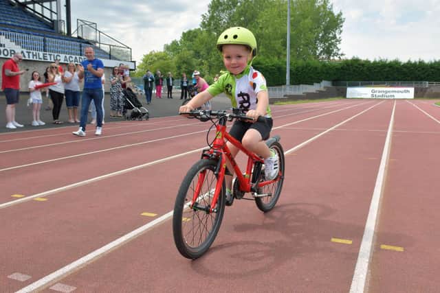 Family and friends were at Grangemouth Stadium to cheer Ché on as he completed the final lap of his fundraiser.  Pic: Michael Gillen.
