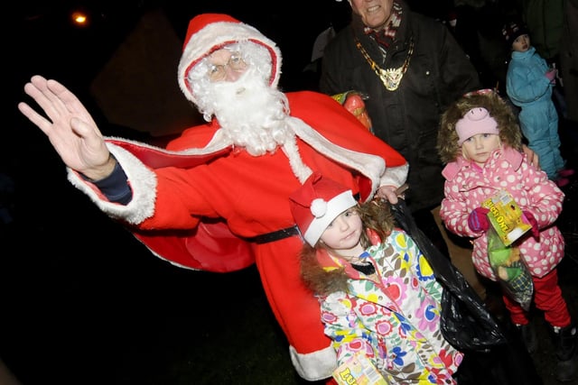 Santa joined in the carol singing.