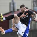 Matty Aitken looks to direct the ball goalward against St Johnstone