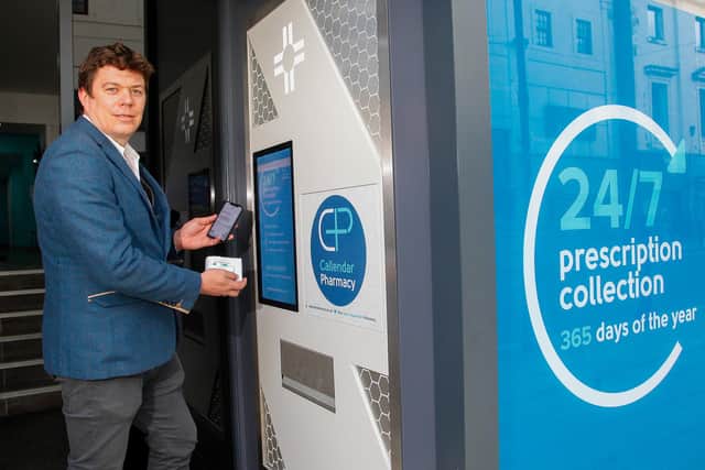Richard Grahame, owner of Callendar Pharmacy in Falkirk High Street, using the new dispensing machine that allows customers to access prescriptions 24/7