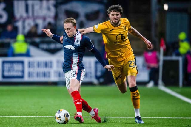 FALKIRK, SCOTLAND - JANUARY 31: Falkirk's Calvin Miller (L) and Livingston's Robbie Muirhead in action during a William Hill Championship match between Falkirk and Livingston at The Falkirk Stadium, on January 31, 2025, in Falkirk, Scotland, (Photo by Sammy Turner/SNS Group)