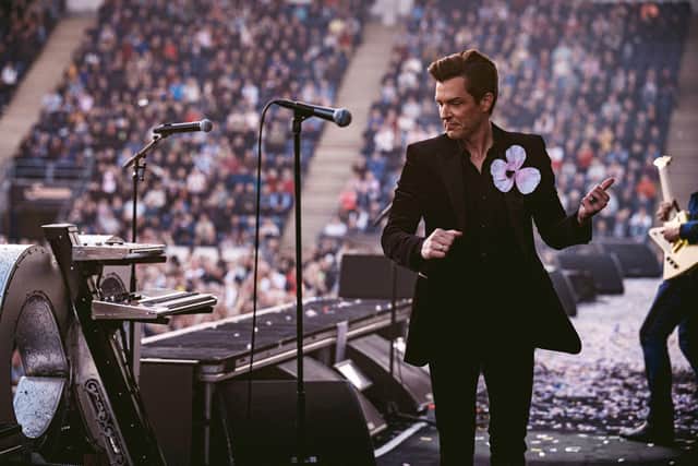Brandon Flowers and his The Killers bandmates take to the stage. Pics: Rob Loud