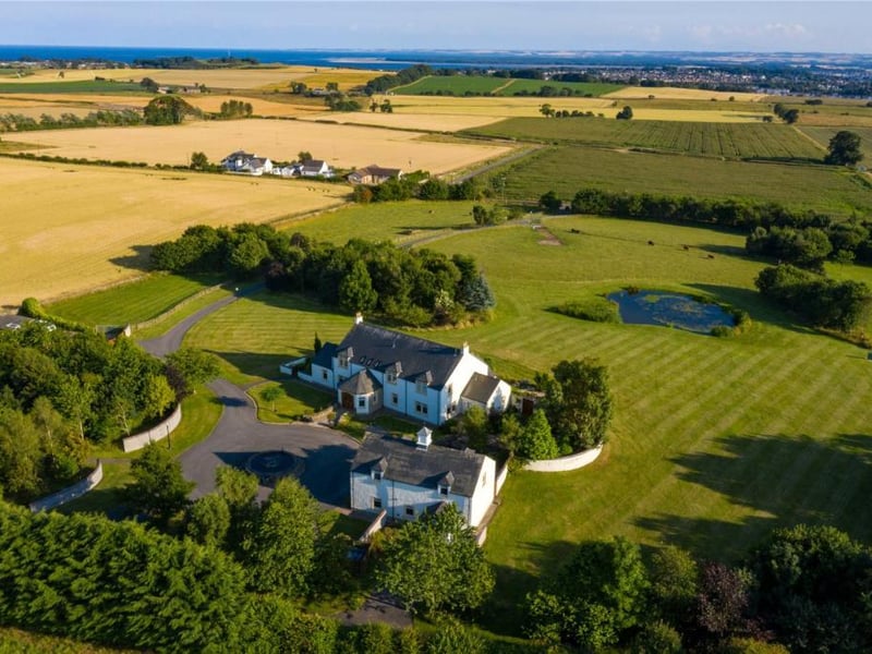 Aerial view of property and grounds.