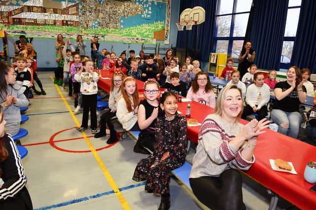 Pupils at Easter Carmuirs Primary enjoyed a special breakfast assembly at the end of term with a visit from Santa.  (Pics: Michael Gillen)